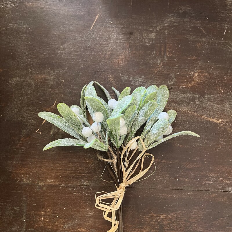 The Mistletoe Pick has six individual stems that are heavily glittered with white berries and tied togehter with a raffia bow so they can be kept as they are or each stem tucked into a wreath, floral arrangement or anywhere you need a touch of sparkle. Each stem measures 7 inches tall