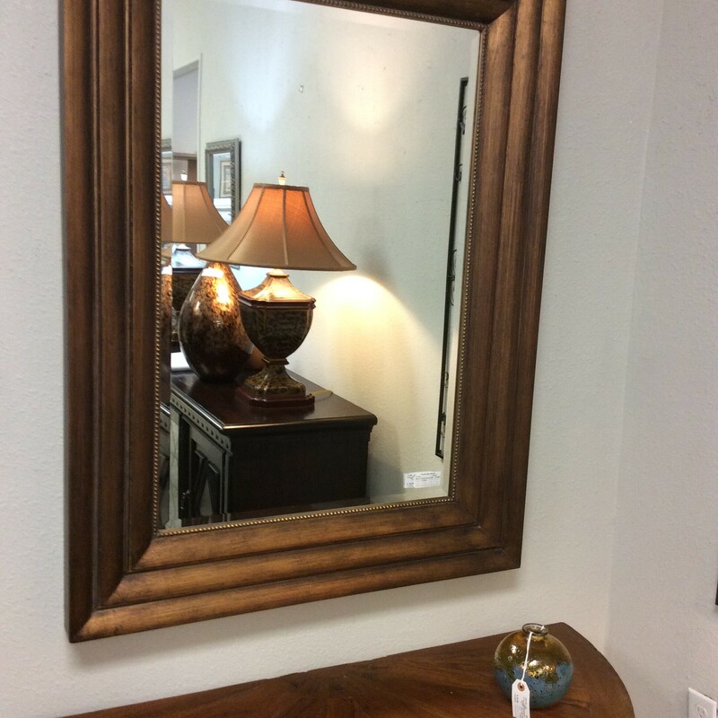 This impressive mirror from The Bombay Company has a beveled mirror with an oversize frame ans beaded fillet detail.