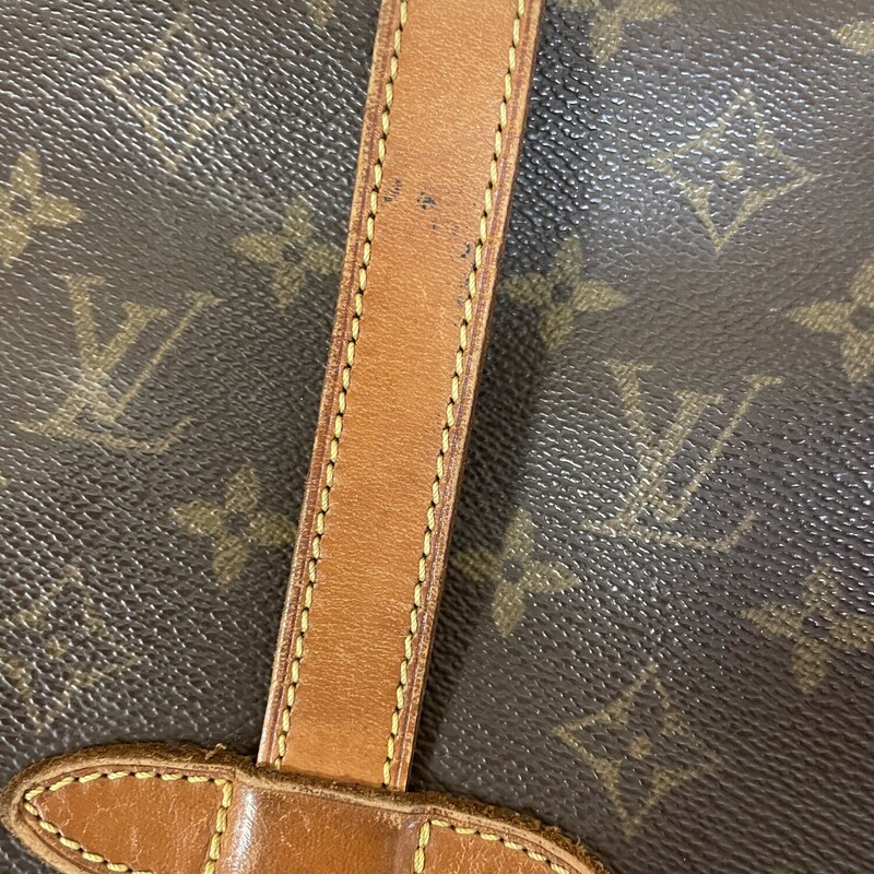 LV Saumur 35, Brown, Size: As Is.  Louis Vuitton Messenger Bag, LV Monogram, Brass Hardware With Some Discoloration On The Buckles , Leather Trim, Single Adjustable Shoulder Strap Leather Trim Embellishment, Discoloration And Cracking On The Straps And The Trim Around The Opening Of The Purse Also On The Leather Logo Plate, Canvas Lining With Some Discoloration Under The Flaps Right Behind The Buckles, Three Interior Pockets, Buckle Closures at Front & Back.

Details Shoulder Strap Drop Max: 21 inches,
Shoulder Strap Drop Min: 17.5 inches, Height: 12 inches, Width: 13, inches, Depth: 4 inches.