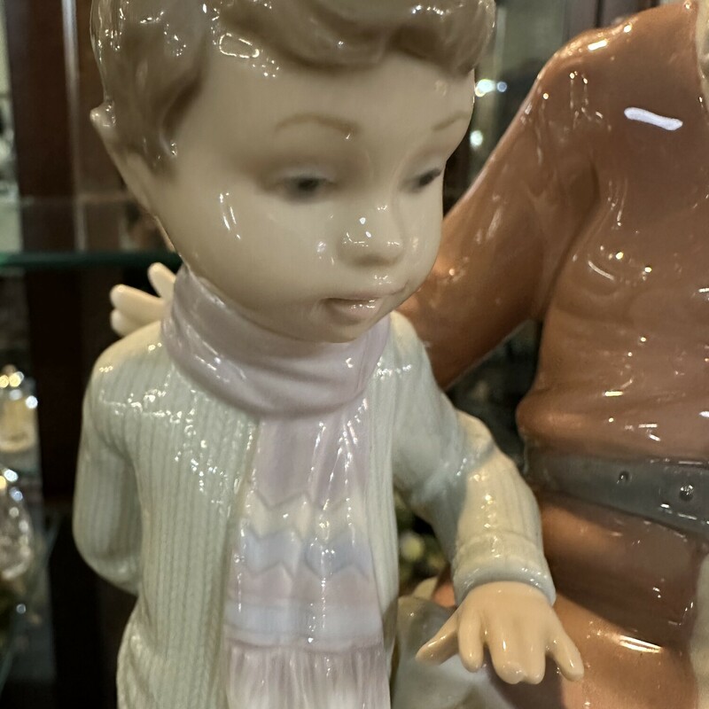 LLadro Santa, 'Special Toy is a whimsical retired Santa.This figurine depicts a young boy with Santa looking at his special toy. The piece measure approximately 9tall an d 7wide. No original box is availabl. Shipping will be $25.00 . in EXCELLENT CONDITION