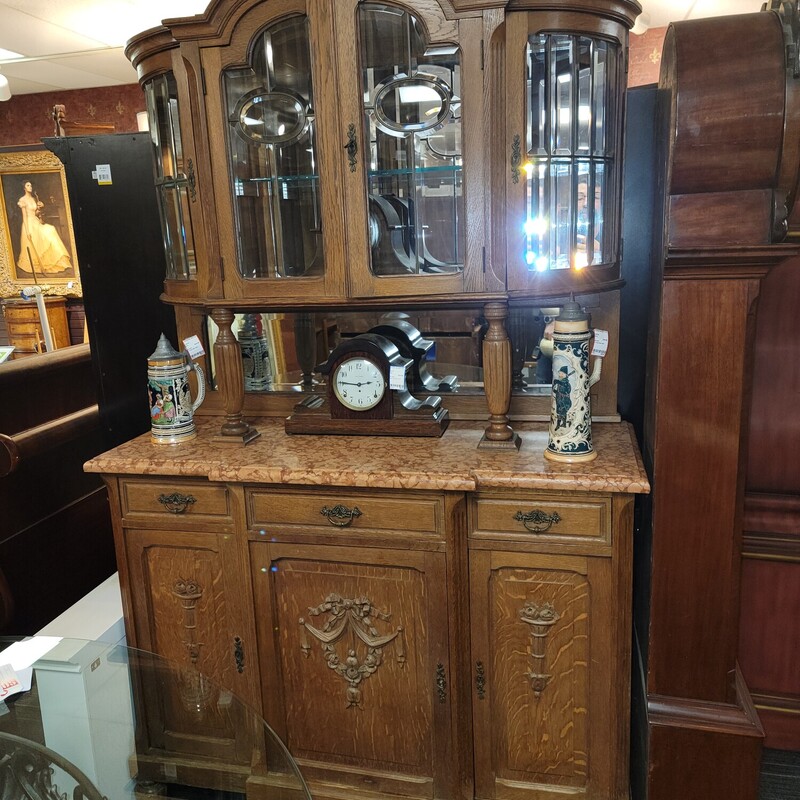 Fantastic French Oak Sideboard with Marble Top and Curved Leaded Glass Top in very good condition.  Has 30 beveled glass panels set with lead dividers.  Has a mirrored back and 1 plate glass shelf on top. Has three Oak drawers in base and doors for storage.   Measures 51' wide; 19' deep; 83' tall.
