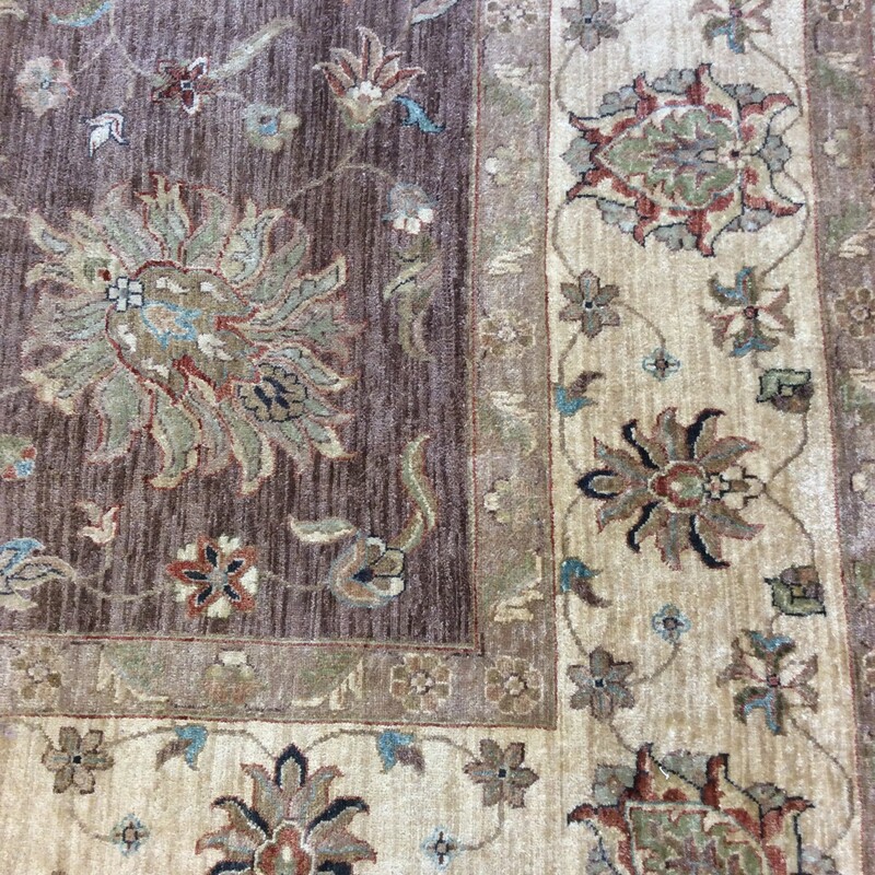 This is a beautiful, floral pattern, brown and cream Wool Rug.