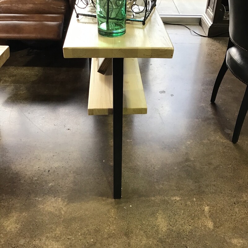 This handmade console table by one of our local artists features a lower shelf and black modern legs. This piece is super versatile and could work as a server, behind a sofa or in a hall.

Dimensions are 65 in x 14 in x 32 in