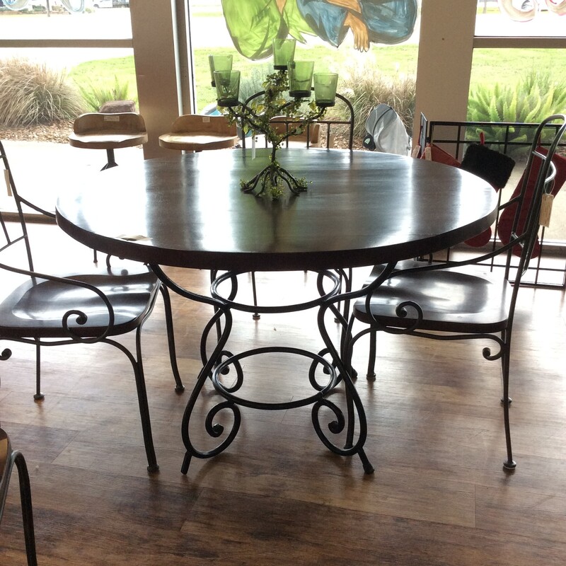 This is a beautiful round, dark wood table with rod iron base.