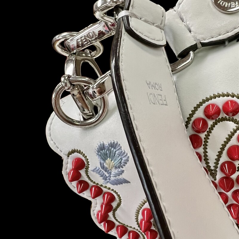 Fendi Kan I Handbag Embroidered Studded Leather Medium Handbag
This authentic Fendi Kan I Handbag Embroidered Studded Leather Medium is a uniquely designed bag perfect for the stylish fashionista. Crafted from white leather, this bag features contrasting studs in the characteristic bow design, embroidered flower details, leather top handle, detachable leather strap, double stud two-tone plexiglass twist-lock closure and silver and gold-tone hardware accents. Its twist-lock closure opens to an off white microfiber-lined interior divided into two compartments and with a slip pocket perfect for storing your bare essential. Its detachable strap allows this bag to be worn longer on the body for added versatility.
******Estimated Retail Price: $3,550*******
Condition: Very good. A-/B+ Wear consistent with age and use.  Slight curling on front, creasing on sides, minor wear underneath flap, and in interior. Minimal scratches on hardware.
Accessories: detachable strap and handle.
Measurements: Handle Drop 5\", Height 7.5\", Width 10\", Depth 5\", Strap Drop 18\"
Designer: Fendi
Model: Kan I Handbag Embroidered Studded Leather Medium
COMES WITH CERTIFICATE OF AUTHENTICITY