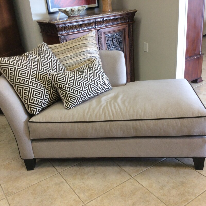 Soft as butta'! This chaise lounge will make you feel like you're in the clouds! Contemporary in design, it's lines are clean and simple. Upholstered in the softest taupe with brown piping and 3 sumptuous accessory pillows. Best of all, there is a matching loveseat priced separately.