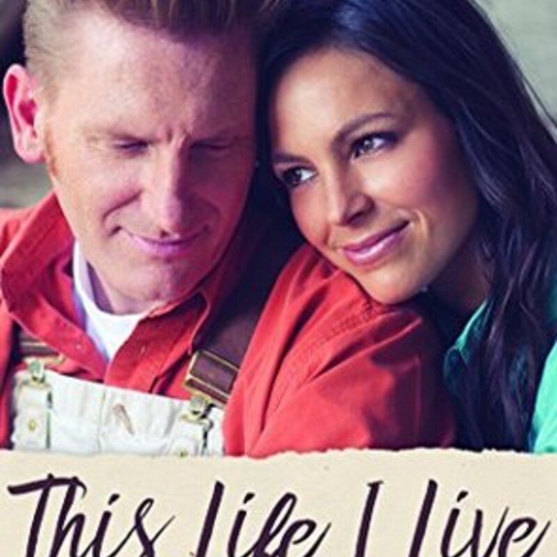 Audio
Non-Fiction
This Life I Live: One Man's Extraordinary, Ordinary Life and the Woman Who Changed It Forever
by Rory Feek

**NEW YORK TIMES BESTSELLER**

Her story. His story. The love story of Joey and Rory.

By inviting so many into the final months of Joey’s life as she battled cancer, Joey and Rory Feek captured hearts around the world with how they handled the diagnosis; the inspiring, simple way they chose to live; and how they loved each other every step of the way. But there is far more to the story.

“My life is very ordinary,” says Rory. “On the surface, it is not very special. If you looked at it, day to day, it wouldn’t seem like much. But when you look at it in a bigger context—as part of a larger story—you start to see the magic that is on the pages of the book that is my life. And the more you look, the more you see. Or, at least, I do.”

In this vulnerable book, he takes us for the first time into his own challenging life story and what it was like growing up in rural America with little money and even less family stability.

This is the story of a man searching for meaning and security in a world that offered neither. And it’s the story of a man who finally gives it all to a power higher than himself and soon meets a young woman who will change his heart forever.

In This Life I Live, Rory Feek helps us not only to connect more fully to his and Joey’s story but also to our own journeys. He shows what can happen when we are fully open in life’s key moments, whether when meeting our life companion or tackling an unexpected tragedy. He also gives never-before-revealed details on their life together and what he calls “the long goodbye,” the blessing of being able to know that life is going to end and taking advantage of it. Rory shows how we are all actually there already and how we can learn to live that way every day.

A gifted man from nowhere and everywhere in search of something to believe in. A young woman from the Midwest with an angelic voice and deep roots that just needed a place to be planted. This is their story. Two hearts that found each other and touched millions of other hearts along the way.