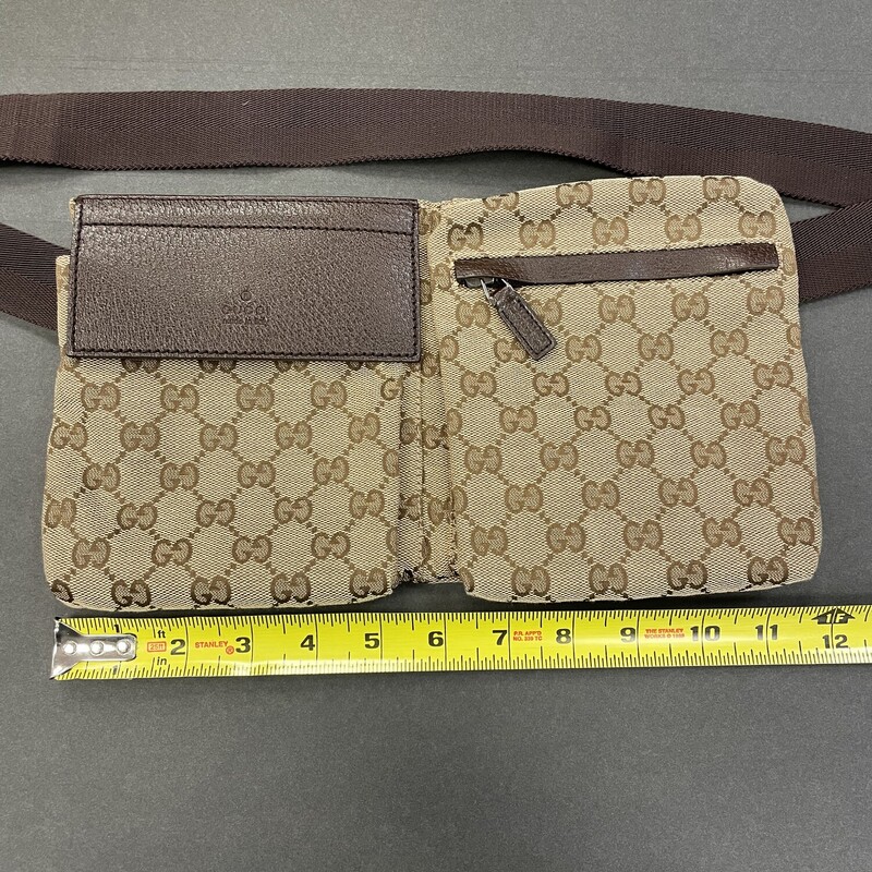Gucci GG Canvas Belt Bag
Strap is adjustable and is in great shape! Two zippered pockets and one with velcro.

Strap Length: 31.25
Height: 6.75
Width: 11.75
Depth: 0.5

shipping may have addtional charge for insurance.