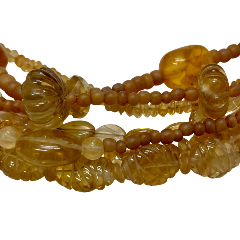 Stephen Dweck Necklace
7 Strand 18in
Amber, Citrine, and Glass Beads
Signed Brass Clasp