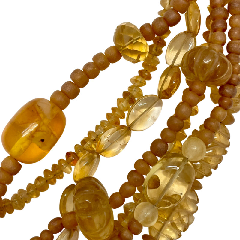 Stephen Dweck Necklace
7 Strand 18in
Amber, Citrine, and Glass Beads
Signed Brass Clasp