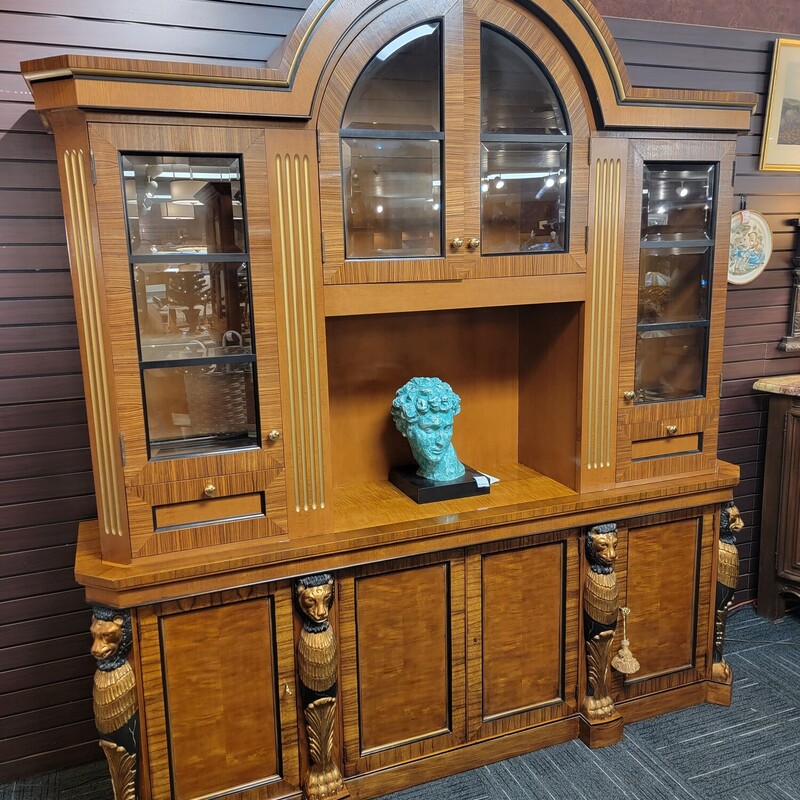 Very Large Egyptian Revival Cabinet with wonderful
4  Carved Lions at Base.  Does have some chips on edges.  Very large; very heavy.  Delivery is not available for this piece.  We can recommend several movies companies.   Comes in 2 pieces.  Measures 87' long; 19' deep; 96' tall.