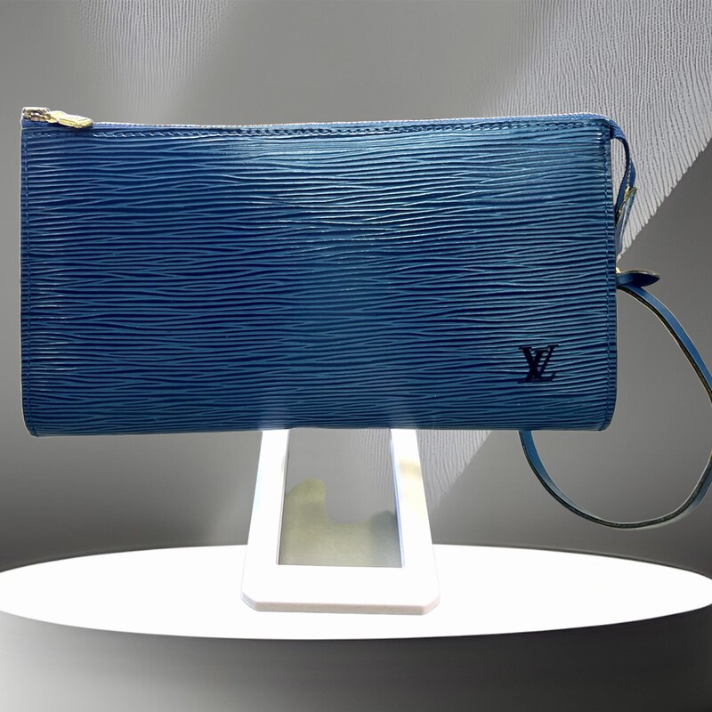 Louis Vuitton Blue Epi Leather Pochette With Logo Embossed On The Exterior, Blue Suede Lining, Gold-tone Hardware, Zipper Closure, Top Handle With A Hook (can Be Worn As A Wristlet)
Comes with CERTIFICATE OF AUTHENTICITY
Brand : Louis Vuitton
Country Of Origin : France
Type : Pochette, Pouch Epi leather
Color : Blue
Closure : Zipper
Size Hxwxd Cm : 11.5cm x 21.5cm x 2.5cm / 4.52'' x 8.46'' x 0.98'' Width Cm : 21.5 Depth Cm : 2.5
Handle Drop Cm : 14.00cm / 5.51''
Serial Number : AR1915 (date: 11 of 1995)
Condition : Used (very good - VINTAGE).   A few traces of usage
This bag is available in similar condition on Mercari for $800.00 and vestiairecollective for $762.00