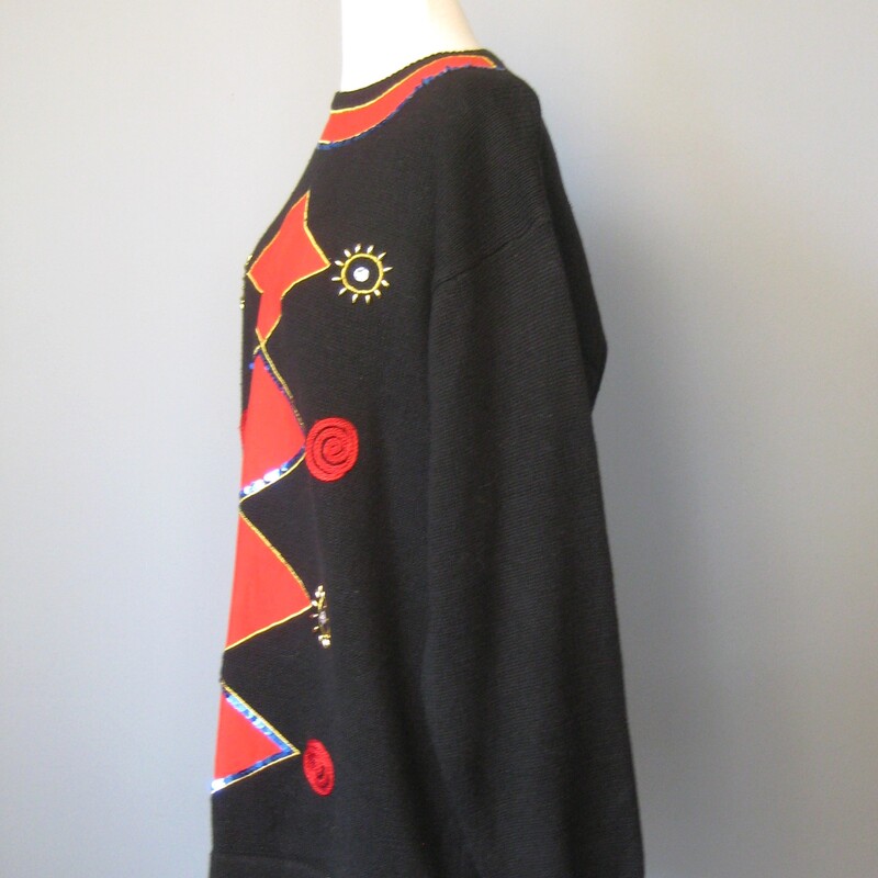 1980s B;acl Novelty sweater with a design on the front, rendered in applique, litter, gold beads and a sprinkling of rhinestones.<br />
long sleeves<br />
crew neck<br />
cotton ramie blend<br />
brand: Crevelle<br />
made in Hong Kong<br />
Marked size XL,<br />
flat measurements:<br />
shoulder to shoulder: 20<br />
armpit to armpit: 23.25<br />
length 24 1/2<br />
undersarm sleeve seam: 16<br />
<br />
excellent condition<br />
thanks for looking!<br />
#57394