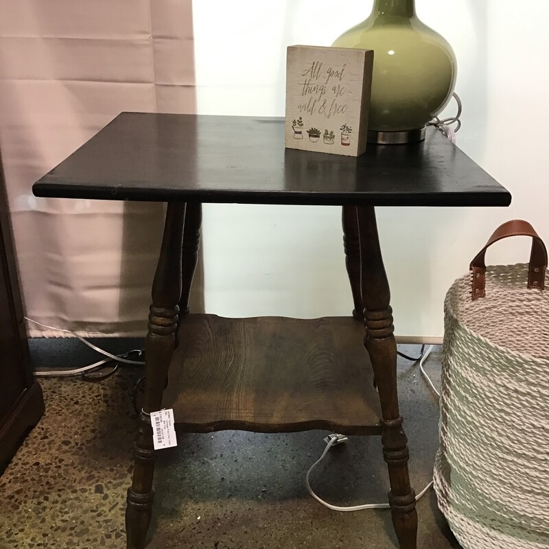 This two-tier table would be great as an end table, foyer table or bedside table. The top has been painted black and is made from oak.
Dimensions were 24 in. x 21 in. x 25-1/2 in.