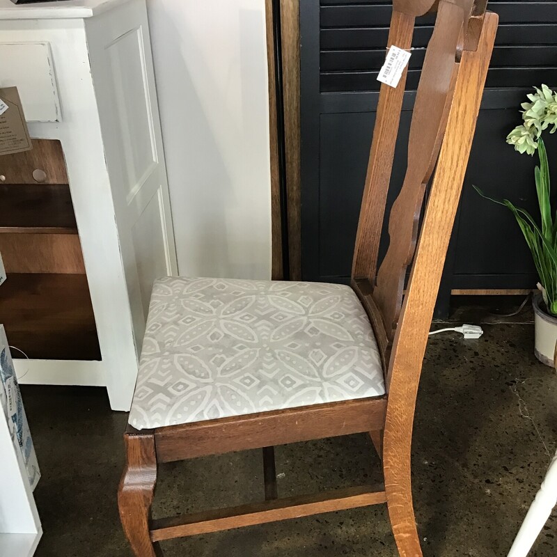 This vintage oak chair has been updated with new foam and a gray/cream upholstery.