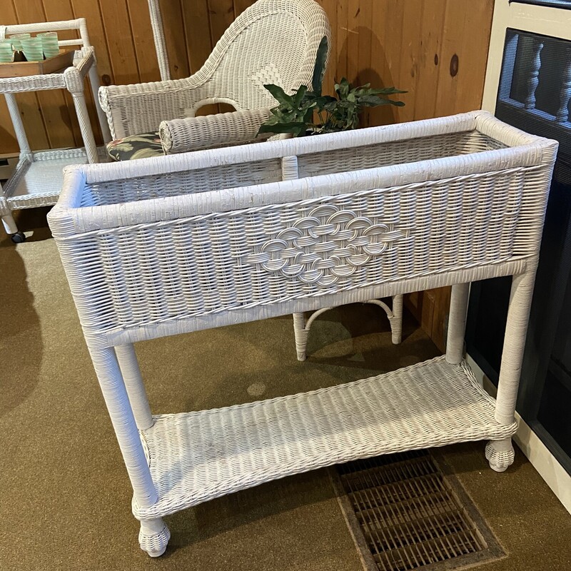White Wicker Plant Stand
Size: 31x10x29
This raised wicker plant stand provides great growing space for your foliage.  It has a metal insert.