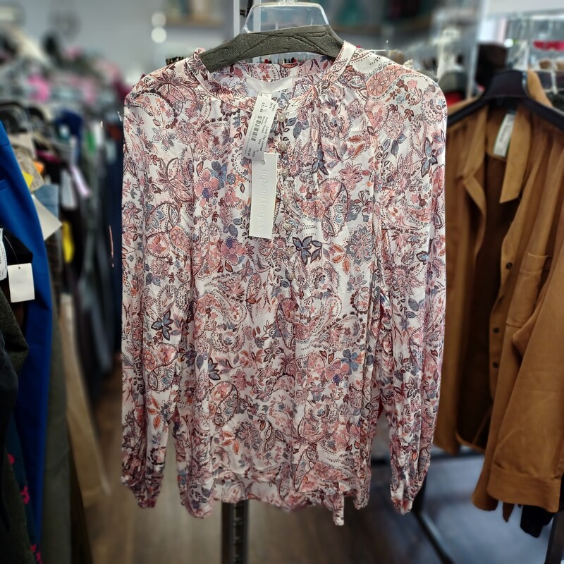 Fresh and ready for spring and summer in this beautiful half front button up top. Super lightweight and can be worn as long or half sleeve with a fastener/tab feature for adjusments. This blouse is brand new with tags by Adyson Parker and is a white background with light pinks and blues in the design.