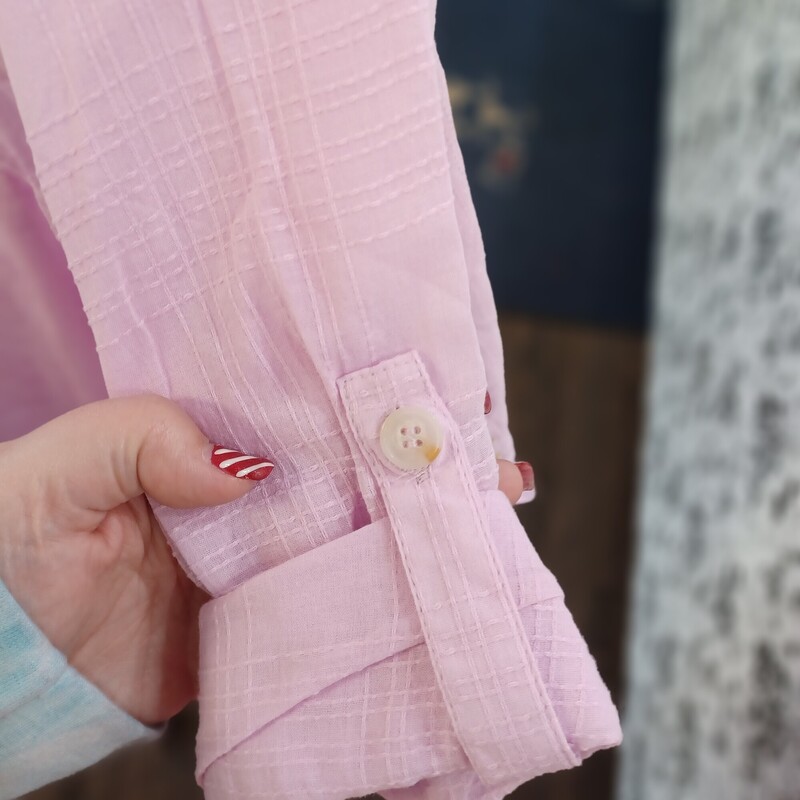 Soft pink is a great color for summer or spring. This lightweight textured blouse is a half button up front that can be worn with long or half sleeves (has a tab/button feature on arm). Brand new with tags by Adyson Parker.