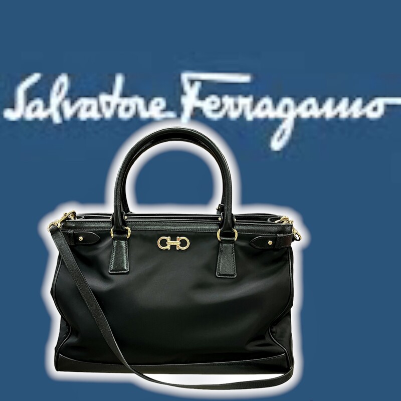 Salvatore Ferragamo -
Nylon Hammered Calfskin Batik Tote Black
This is an authentic SALVATORE FERRAGAMO Nylon Batik Tote in Black. This stylish bag is crafted of nylon canvas with black calfskin leather in black with gold hardware, leather top handles, and a matching leather shoulder strap. The bag opens to a partitioned black fabric interior with a large pockets.
COMES with CERTIFICATE of AUTHENTICITY
Base length: 15 in
Height: 11 in
Width: 7 in
Drop: 5.25 in
Drop: 20.5 in
This tote is in like new condition with no signs of wear or flaws.
