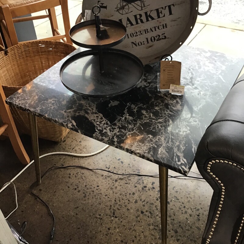 This gorgeous end table features vintage marble from the 1950s! This black and white marble slab sits on a gold base. This is a one-of-a-kind addition to any home!
Dimensions are 30 in. x 30 in. x 21 in.