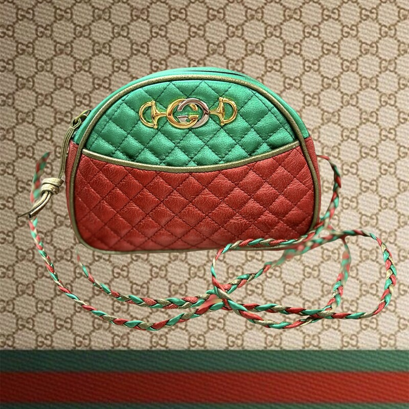 GUCCI
Laminated Nappa Trapuntata Mini Zumi Dome Shoulder Bag
Description:
Gucci Shoulder Bag
Metallic & Red Leather
Colorblock Pattern
Gold-Tone Hardware
Single Shoulder Strap
Poplin Lining
Zip Closure at Top
Shoulder Strap Drop: 25\"
(Adjustable strap, can be worn as a shoulder or crossbody bag)
Height: 5\"
Width: 6.75\"
Depth: 1.5\"
Comes with CERTIFICATE OF AUTHENTICITY
\"The Real Real\" has this bag for $895.00 in similar condition.
This bag is in like New Condition.