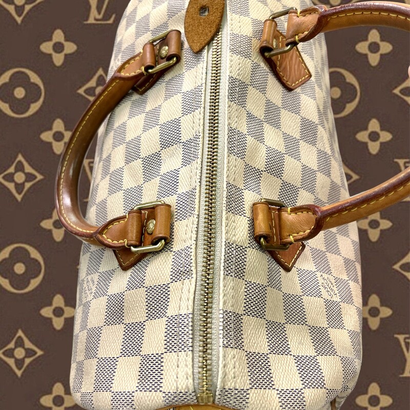 Louis Vuitton<br />
This is an authentic LOUIS VUITTON Damier Azur Speedy 30. This is a stylish, iconic tote, crafted of Louis Vuitton Damier coated canvas in blue and white. The handbag features natural vachetta cowhide leather trim and rolled top handles with brass handle rings. The brass top zipper opens to an interior of beige fabric with a hanging patch pocket.<br />
<br />
Base length: 12 in<br />
Height: 8.5 in<br />
Width: 7 in<br />
Drop: 3.5 in<br />
COMES with CERTIFICATE of AUTHENTICITY<br />
This Speedy is pre-loved and does show signs of wear.