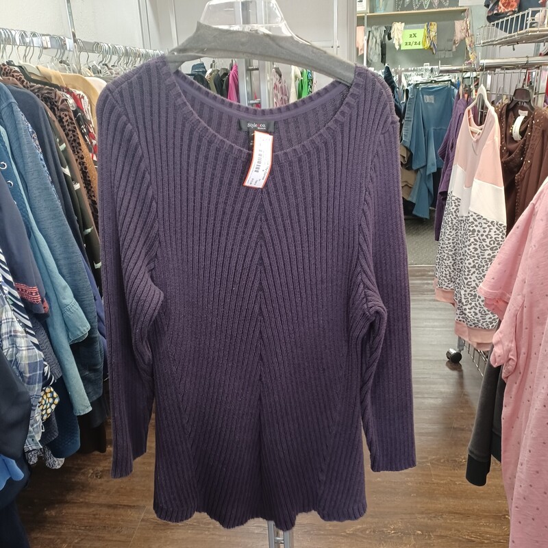 Deep purple in color, this knit sweater has ribbing that is sure to flatter. So cute and perfect for those cold winter days.