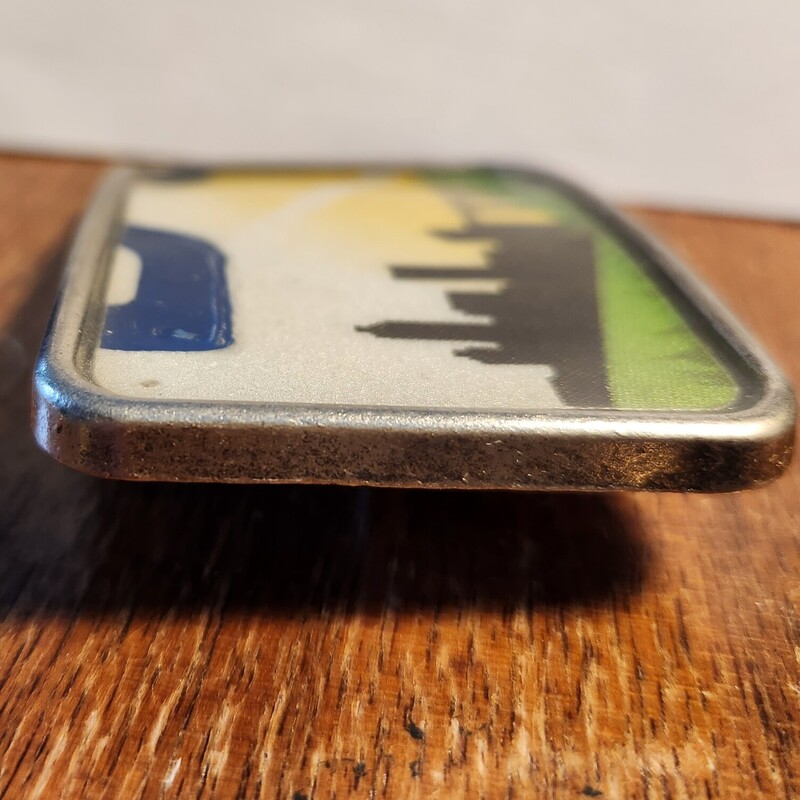 Vintage License Plates have been used to make resin filled belt buckles.
Made by a local friend 10 years ago.  These have not been used and have been stored.  They are approx. 3 x 2 and roughly 1/4 thick.
The belt opening is for a 1.5 wide belt.   They are  a one of a kind find
PLATE FROM OHIO