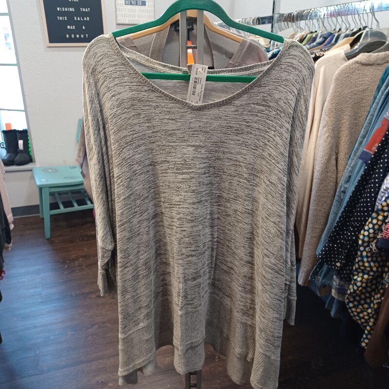 Love this black and grey super light weight sweater with the butterfly fit sleeves for added appeal. So comfy and looks good on any body type.