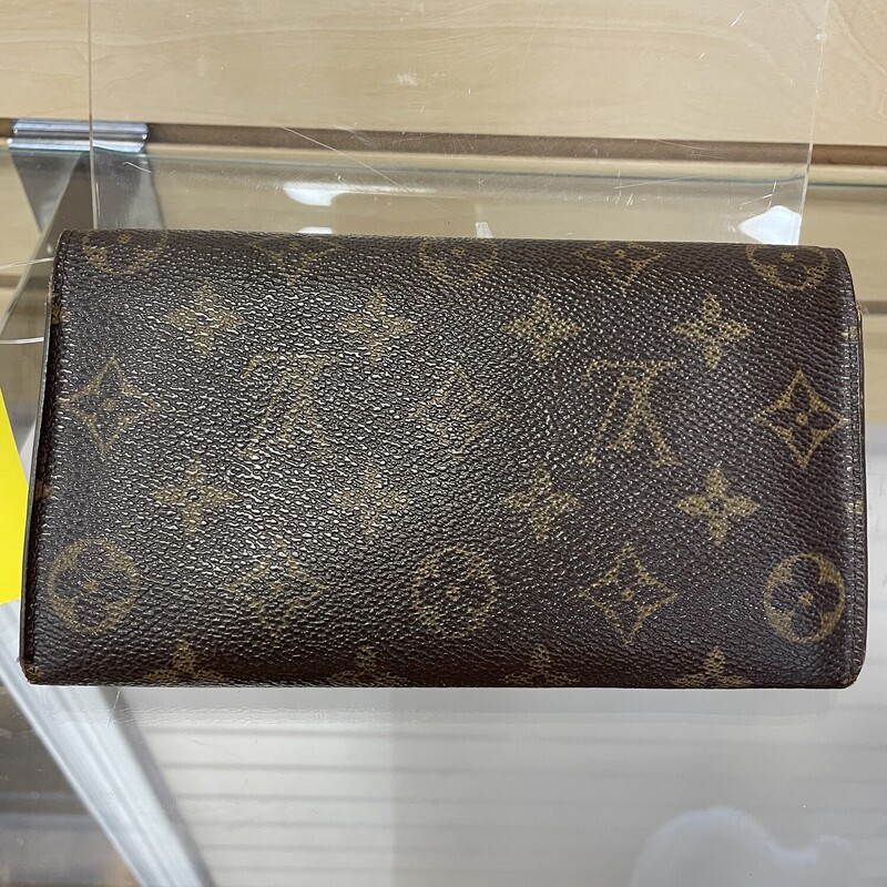LV Sarah Long Wallett As Is, Brown with LV Monogram 3 Pockets with Middle Zippered Pocket and 2 Small Pockets Under the Button Flap Closure, Cracking and Scratches on the Inside of Pockets, Wear on the Outside Corners and on the Zipper Pull , Size: 7.25 x 4.25 x .5 inches.