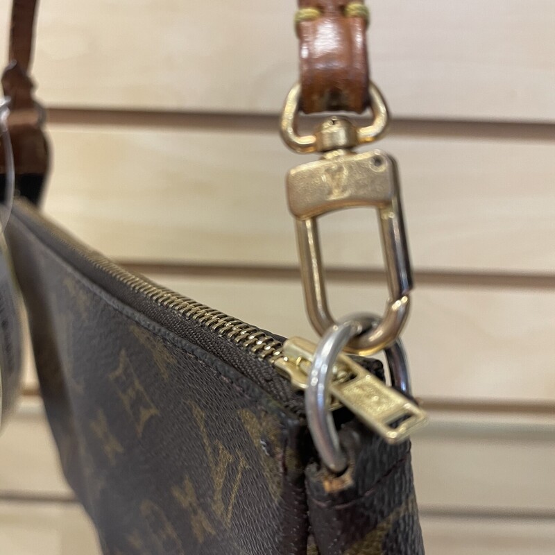 Sale!! was $449.99 NOW $359.99<br />
<br />
LV Pochette As Is, Brown with LV Monogram, Replaced Zipper, Cracking and Staining on the Handle, Detatchable Handle, Some Staining on the Bottom of the Lining, Gold Plating Coming Off on the Hardware,<br />
Size: 8.5 x 5 x 1.5 inches, 6 inch Strap Drop<br />
<br />
*Additional shipping and insurance rates will apply. A separate invoice will be sent due to the value of this item.