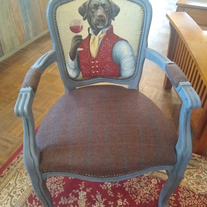 Doggie With Wine Chair

Unique chair with black dog and his wine on the back of upholstered chair.  Blue painted wood frame.

Size: 24 in wide X  21 in deep X 36 in high