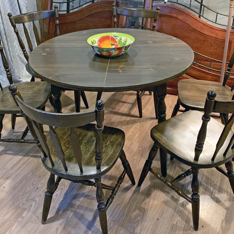 Dark Wood Table with Six Chairs and One Leaf - $153.
42 In Round x 30 In Tall with an 11.5 Inch Leaf.