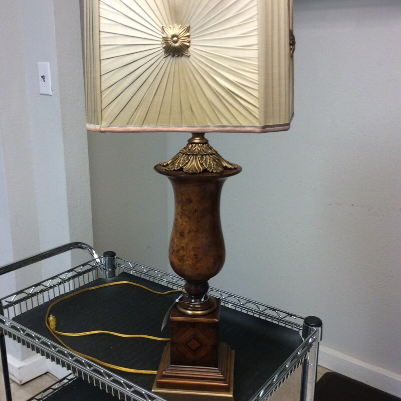 This handsome traditional style lamp has an inlaid wooden base with antique brass accents.