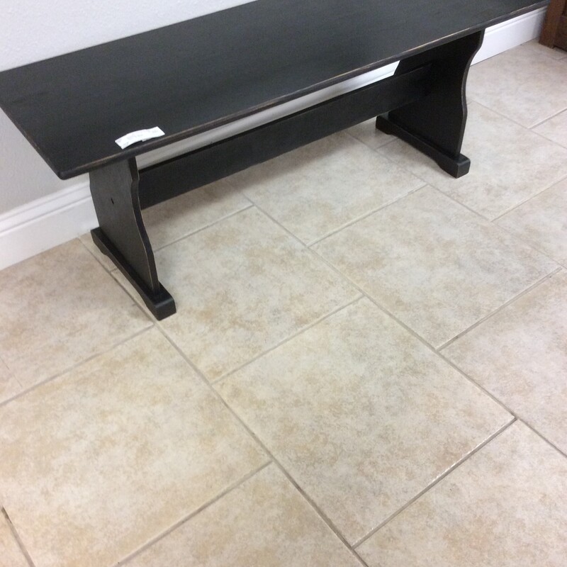 Traditional style tressle bench with black painted finish.