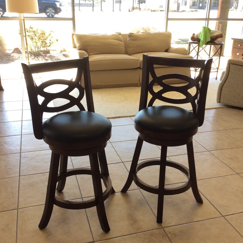 This nice pair of barstools features a wood base and black leather upholstery.