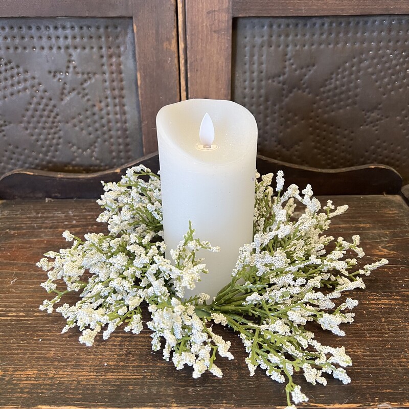 This pretty white candle ring is perfect for any season and with any decor. Candle ring measures 9 inches in diameter and inner 3 and one half