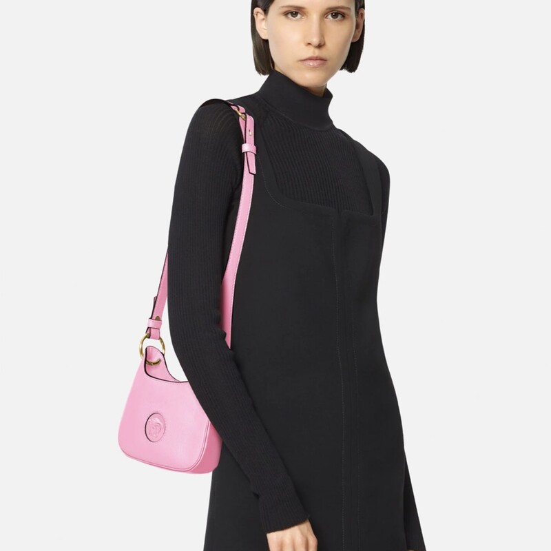 VERSACE<br />
LA MEDUSA SMALL HOBO BAG<br />
A stunning evening design with a contemporary curved silhouette, the small hobo bag is crafted in Italy from lightly grained calf leather. The striking design is a perfect companion for both day and evening looks, boasting a three-dimensional Medusa plaque - iconic décor that was discovered on the doors of the brand's first headquarters in Milan. Easily styled on the shoulder or across the body, the versatile design features an adjustable strap.<br />
-La Medusa plaque<br />
-Top handle<br />
-Flat internal pocket<br />
-Embossed logo on reverse<br />
-Outer fabric: 100% Calf leather<br />
-Lining: 100% Cotton<br />
-Made in Italy<br />
<br />
Size & Fit<br />
-Length: 20 cm<br />
-Width: 4 cm<br />
-Height: 13 cm<br />
-Handle drop: min 21, max 50 cm<br />
This bag is in great condition.<br />
Nordstrom has this brand new NOW for $1825.00<br />
Rebag has it available in similar condition for $1170.00 and poshmark has it for $1131.00