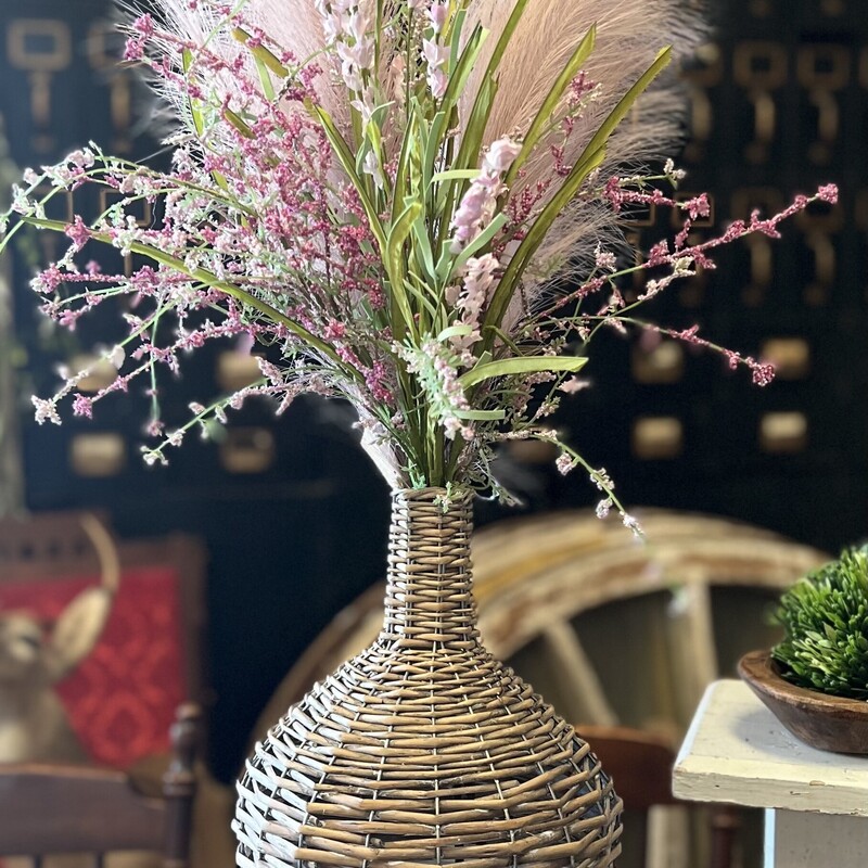 Add a touch of Boho to any room in your home. This Wicker Demijohn looks great with pampas grass, greery or just about any floral you like
Measures 15 inches tall and 8.25 inches diameter