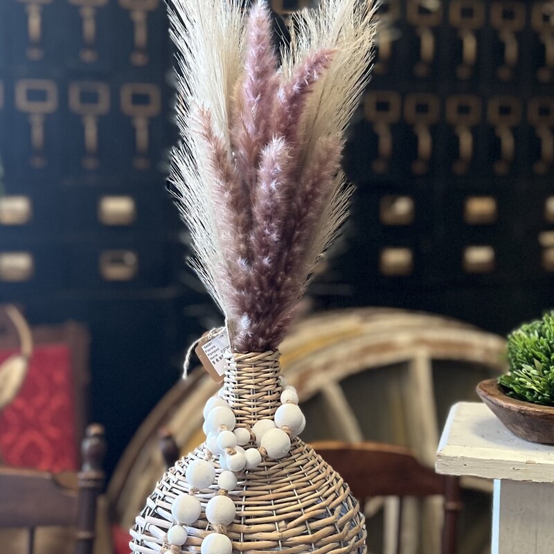 Add a touch of Boho to any room in your home. This Wicker Demijohn looks great with pampas grass, greery or just about any floral you like
Measures 12 inches tall and 7.5 inches in diameter