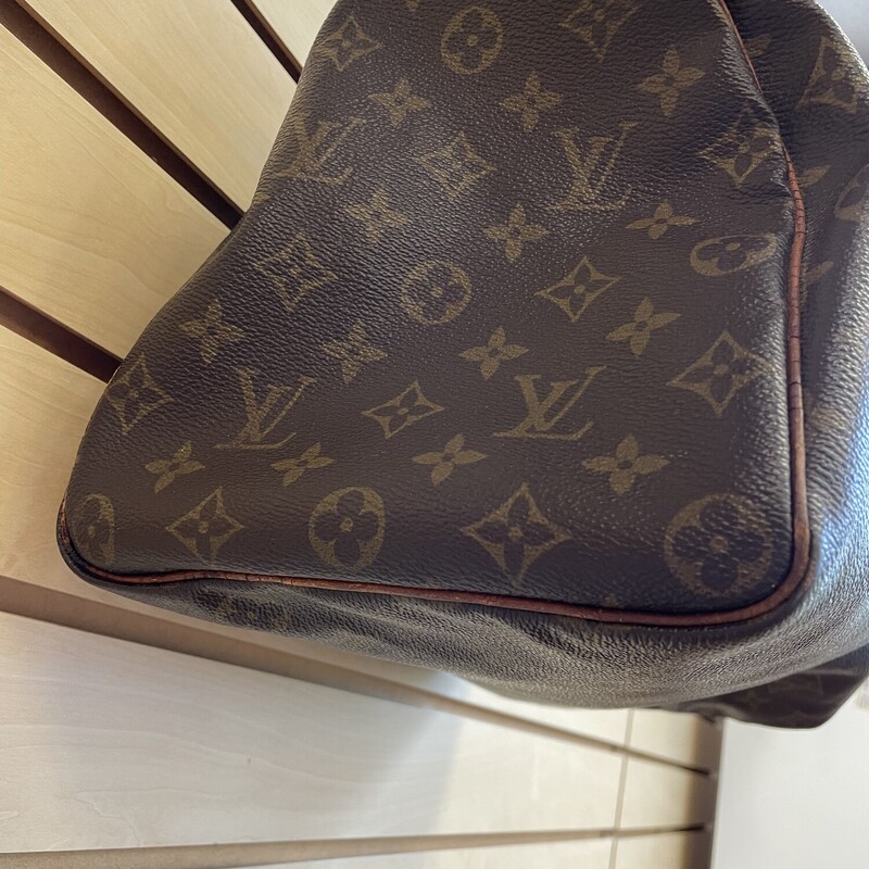 Reduced now to 269.99!!!! Was $449.99<br />
<br />
L. V.  Speedy 35 Purse with Lock and Key As Is, Brown Logo Monogram Coated Canvas with Canvas Interior, Several Stains Throughout the Interior Lining, One Small Interior Pocket - Has Staining and Leather Opening is Cracked, Water Marks and Cracking on the Leather Exterior Handles and Piping, Torn and Cracked Leather on the Zipper Pull Tabs and the Zipper<br />
<br />
Size: 13.75x7x8.5 inches<br />
<br />
Reduced now to 269.99!!!!<br />
<br />
*Additional shipping and insurance rates will apply. A separate invoice will be sent due to the value of this item.