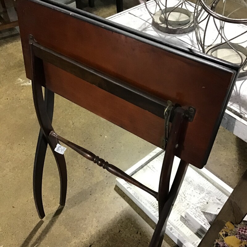 This folding wooden table would be a great piece for next to a chair or sofa and could be stored if you do not want it out all the time!
Dimensions are 24 in x 20 in x 28-1/2 in.