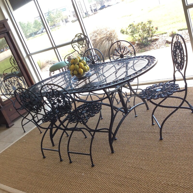 This is a beautiful vintage 7 piece, black iron, patio set.  All 6 chairs are foldable for easy storage.