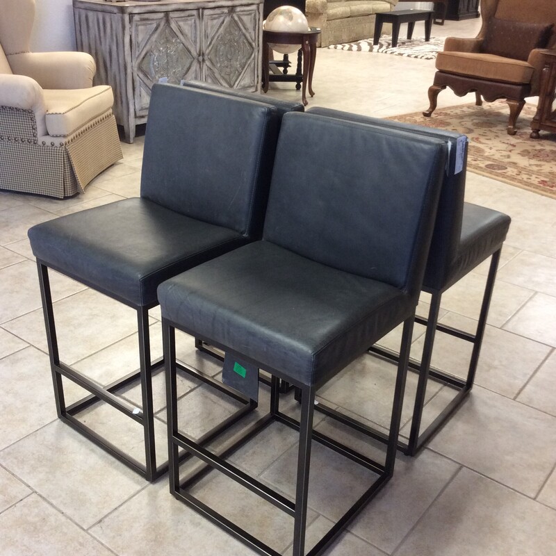 This set of four barstools from Restoration Hardware are covered in a soft grey leather with metal bases.