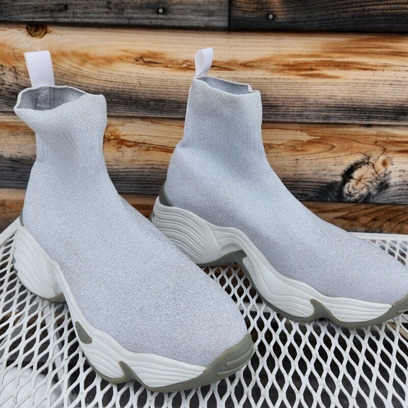 Emporio Armani Silver Shimmering Elastic Booties<br />
Size 8m<br />
Retail $495<br />
Rare Find<br />
EUC<br />
Styled similar to the Chelsea boot and the sneaker.