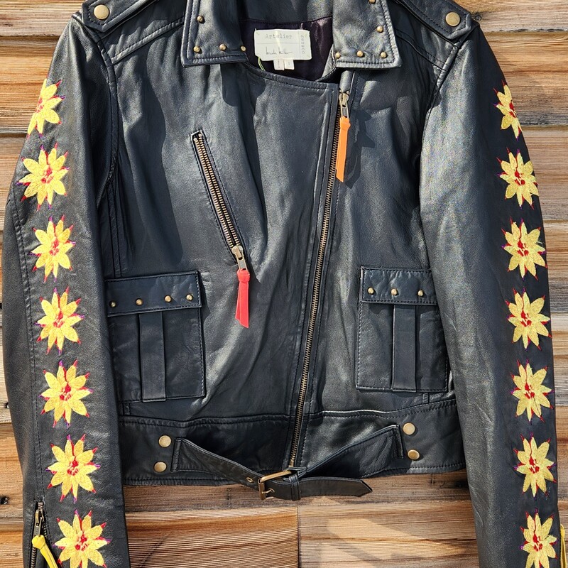 A classic Nicole Miller Artelier Leather Moto Jacket<br />
Black Biker style Jacket Embellished with Flowers and Studs<br />
Zipper Sleeve, two flap pockets - one zipper pocket<br />
Size Small<br />
Pit to Pit 19.5 inches<br />
Pit down sleeve 19 inches<br />
Waist 17 inches across<br />
Pit down to wait 12 inches<br />
RARE FIND<br />
RETAIL $900<br />
LIKE NEW
