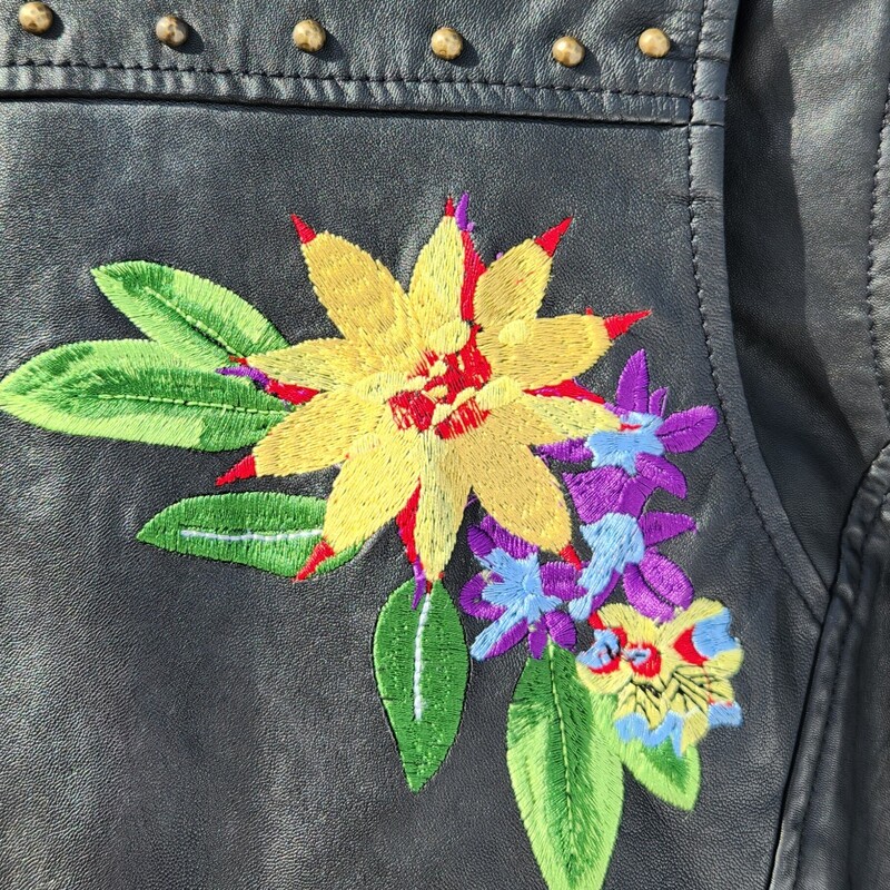 A classic Nicole Miller Artelier Leather Moto Jacket<br />
Black Biker style Jacket Embellished with Flowers and Studs<br />
Zipper Sleeve, two flap pockets - one zipper pocket<br />
Size Small<br />
Pit to Pit 19.5 inches<br />
Pit down sleeve 19 inches<br />
Waist 17 inches across<br />
Pit down to wait 12 inches<br />
RARE FIND<br />
RETAIL $900<br />
LIKE NEW