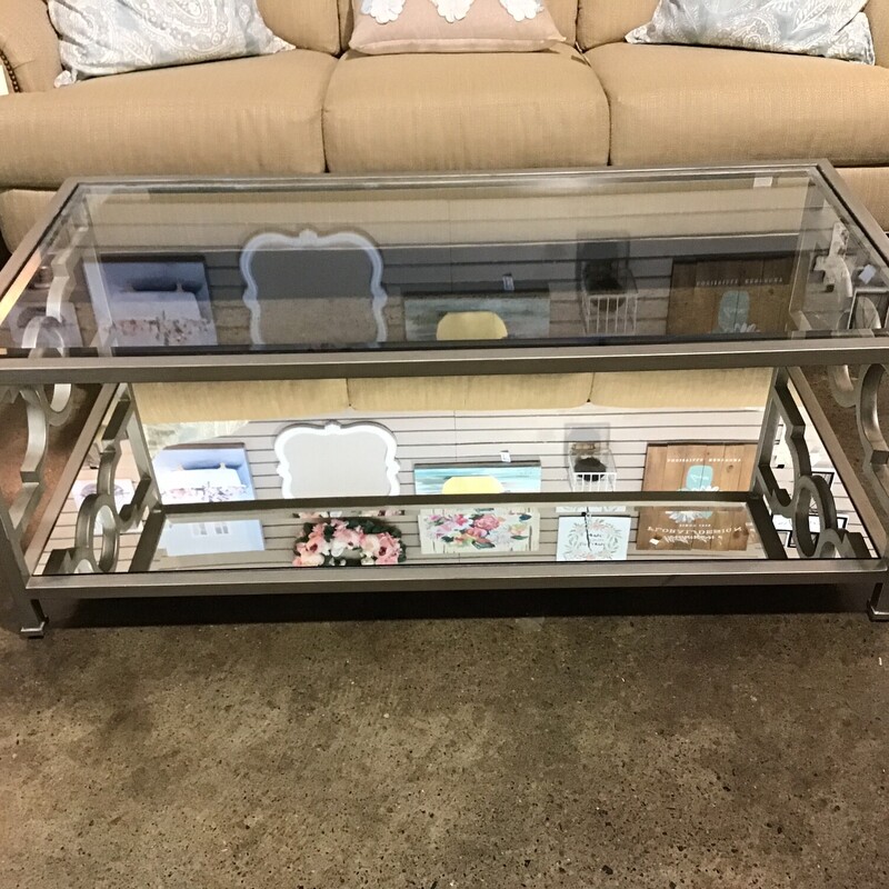 Sleek & modern style
Glass top
Mirrored bottom shelf
Silver trim
Decorative sides
Candace Olsen Collection
by Highland House Designer Furniture

BEAUTIFUL piece

Dimensions:  52x25x19