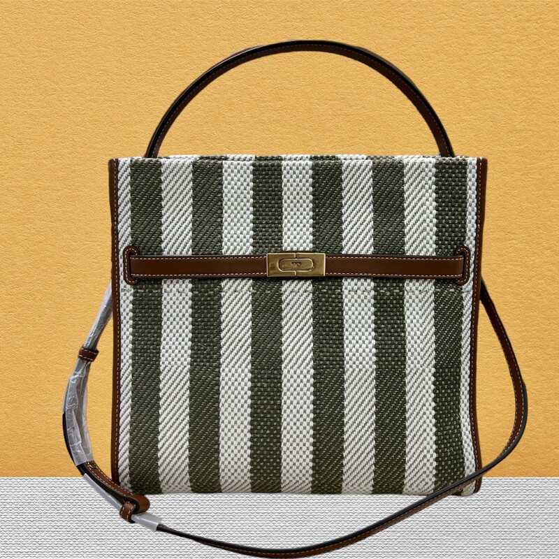 TORY BURCH
LEE RADZIWILL STRIPE DOUBLE BAG
Original Retail Price:  $1,098
Comes with Original Dust Cover and Tags
Paper stil on strap
FLAWLESS  in LIKE NEW CONDITION

Lee Radziwill Double Bag contrasts structure and softness, and a mix of materials. A little bit undone, the drape and sense of volume are fundamental to the design. Composed of layers that unfold like the collar of a trench coat, it can be worn open, semi-buttoned or fully closed. Beautifully crafted in leather, suede and a striped twill made of linen of cotton, with signature lock-and-key hardware. The collection is named for Lee Radziwill, who was fearlessly unique.

Fits a laptop up to 15\"
Plain weave, suede and leather trim
Cotton twill lining
Snap stud closures; belted strap with slider buckle closure
Interior top zipper center compartment pocket
5 Interior compartments (1 center zipper compartment, 4 open compartments), 1 side wall zipper pocket, 1 side wall slit pocket
Leather top handle 6\" (15cm) drop
Adjustable, removable shoulder strap with 14.3\" (36cm) drop
Gold-finish hardware
Dust bag included
length: 12.6\" (31.5cm); height: 12\" (30cm); depth: 6.2\" (15.5cm);
Style Number 139204