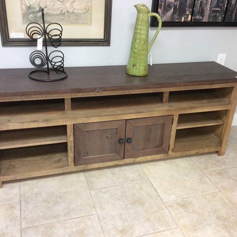 This is a very nice rustic/modern T.V. Stand. This stand has 6 exposed shelfs and a cabinet with 1 hidden shelf with a hole is the back for your cable cords.